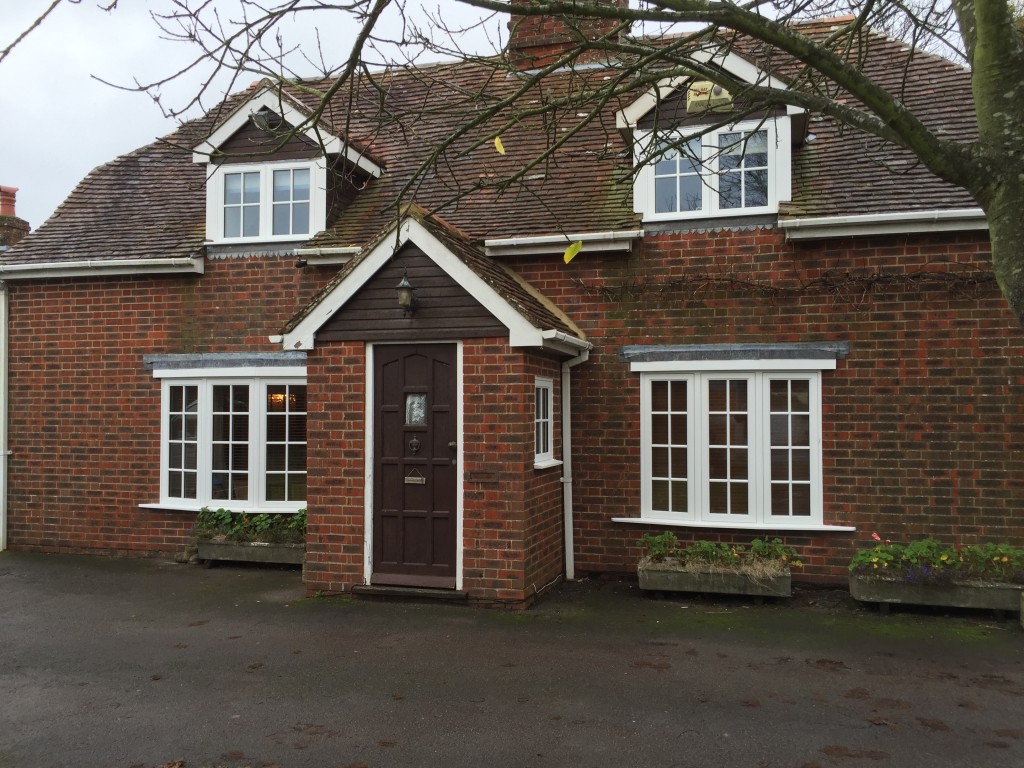Hardwood glazed bow casement windows painted white