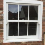 Timber sliding sash window painted white hardwood