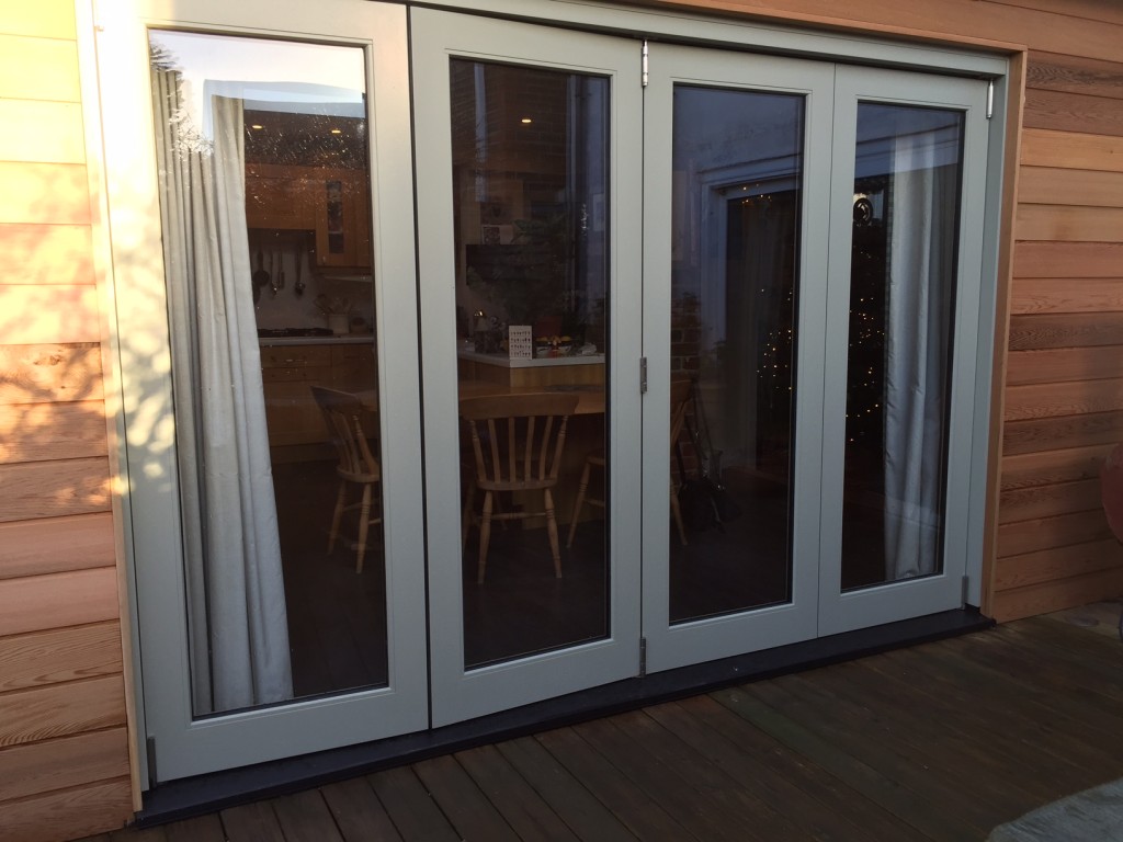 Bi-fold doors fully glazed manufactured accoya painted