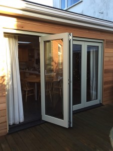 Bi-fold doors fully glazed Accoya painted deck
